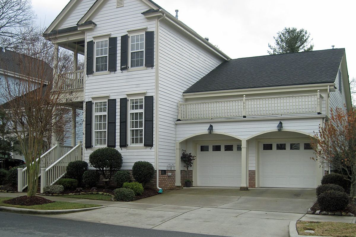 Clean suburban home driveway and lawn for residential concrete leveling