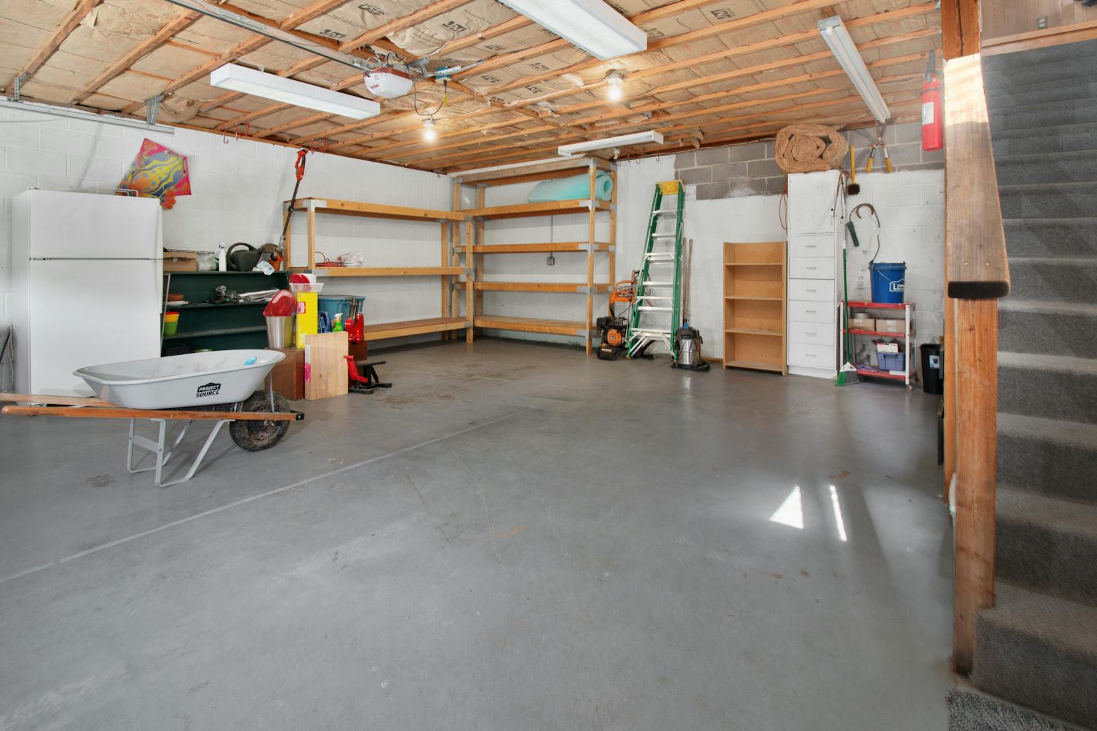 Interior of a residential garage with a bare concrete floor — typical slab for polyurethane lifting