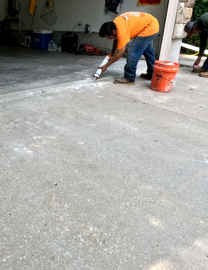 KC MudJack technician completing a residential concrete lift
