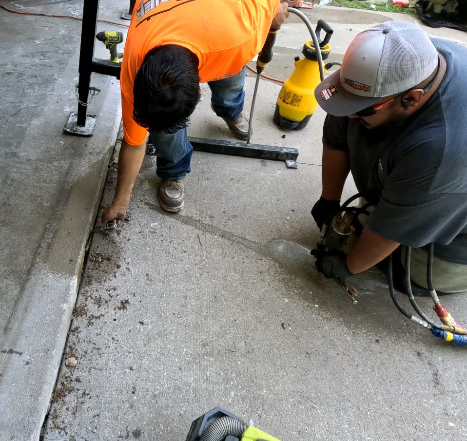 KC MudJack technician evaluating a Kansas City property