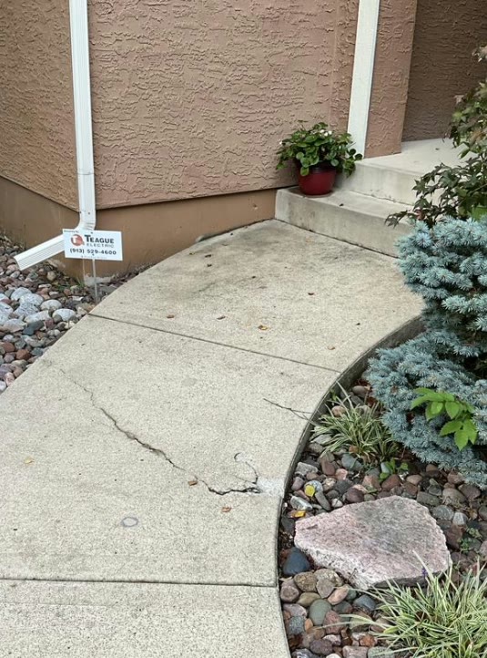 Uneven residential sidewalk prepared for concrete leveling