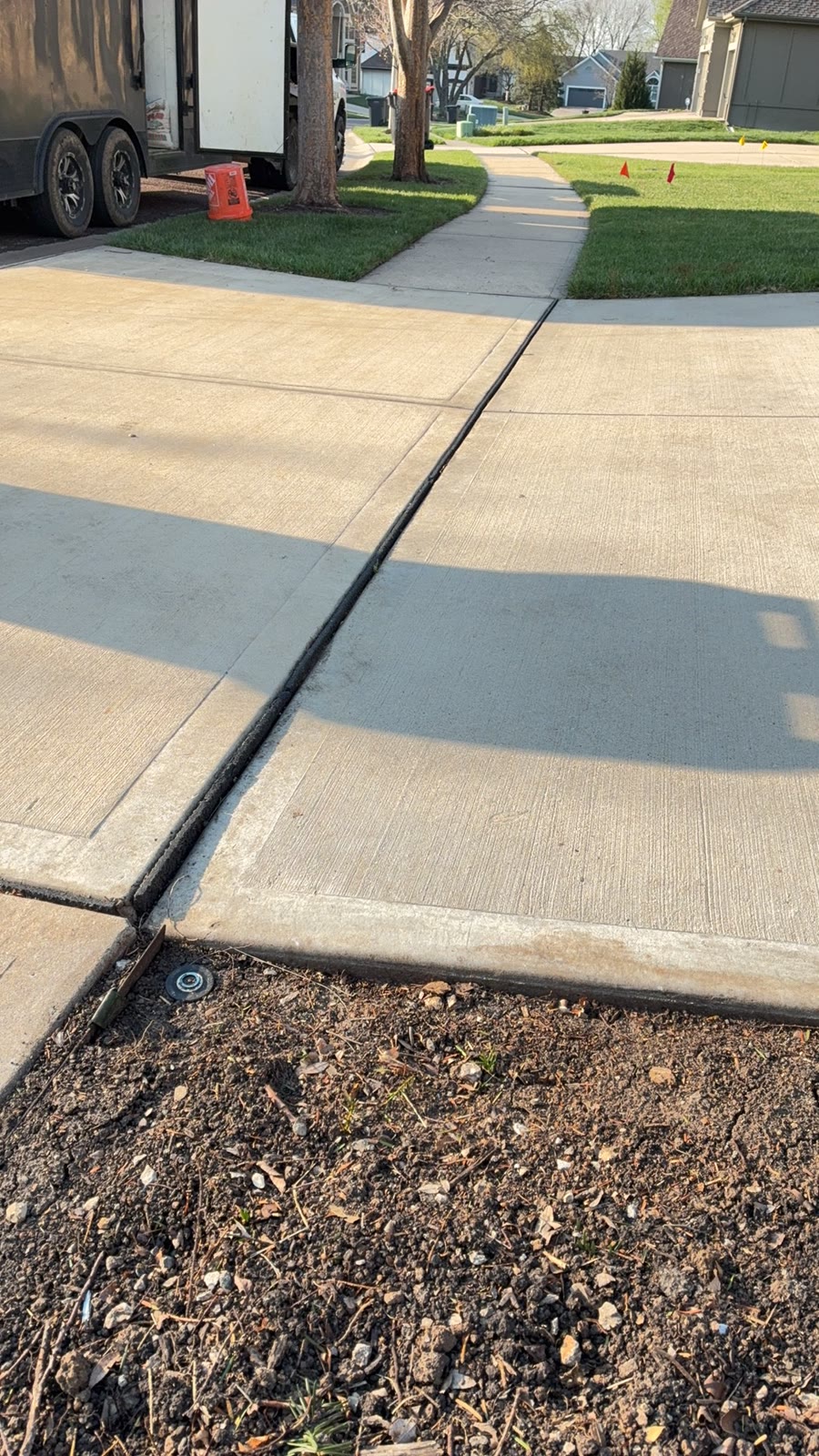 Sunken driveway panel before polyurethane concrete lifting